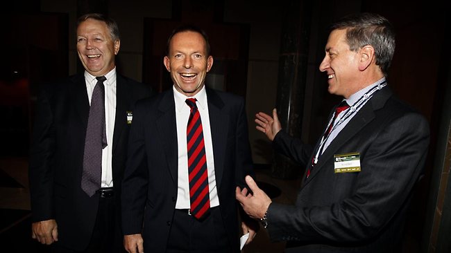A long friendship: Tony Abbott is welcomed to a mining industry lunch in Canberra three years ago by the Minerals Council of Australia’s then-chairman Peter Johnston (left) and its CEO Mitch Hooke. PHOTO: RAY STRANGE/THE AUSTRALIAN