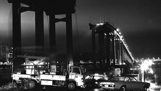 A non-negotiable event: the broken Tasman Bridge on the night of the disaster, 5 January 1975. PHOTO Don Stephens, Mercury