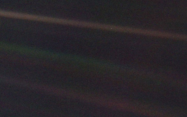 The inner solar system as seen from Voyager 1 on 14 February 1990. Earth is the pale dot in the top coloured band, towards the right of the picture. PHOTO NASA