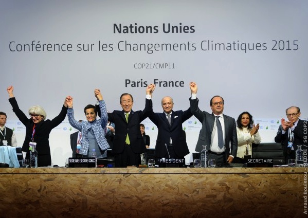 UN and French leaders celebrate adoption of the Paris agreement, 12 December 2015. PHOTO Arnaud Bouissou