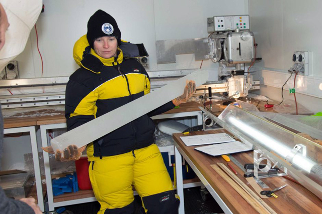 ACE-CRC glaciologist Tessa Vance holds a drill core of ancient Antarctic ice, which has much to tell us about Australia’s evolving climate. PHOTO ABC