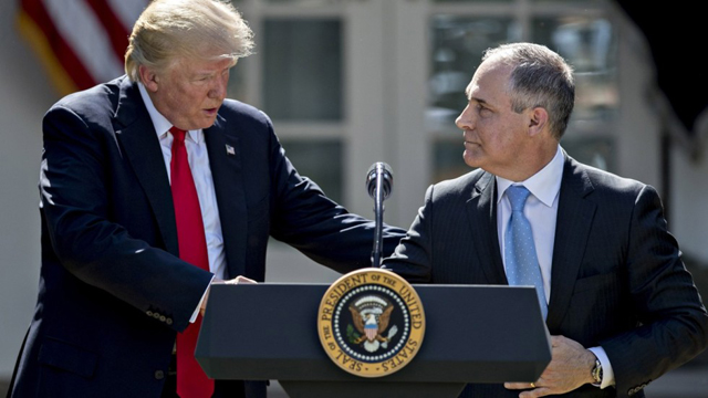 US Donald Trump with Scott Pruitt in the White House Rose Garden on 1 June, announcing the Paris Agreement withdrawal. PHOTO: Bloomberg