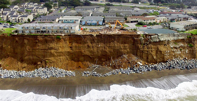 Coastal erosion, Pacifica, California. The apartment block was subsequently demolished. PHOTO Terry Chea/Associated Press