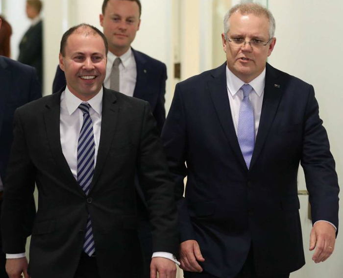New treasurer-to-be Josh Frydenberg can scarcely believe his good fortune as he leaves the Liberal party room with PM-designate Scott Morrison. 
