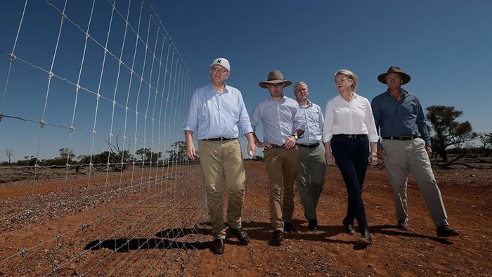 Scott Morrison and entourage on the ground near Quilpie. PHOTO SBS