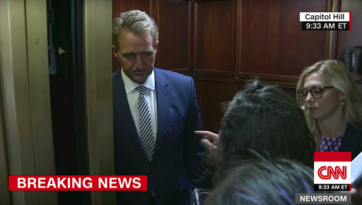 Senator Jeff Flake, who ultimately supported Kavanaugh’s nomination, faces Maria Gallagher in the US Capitol. PHOTO CNN